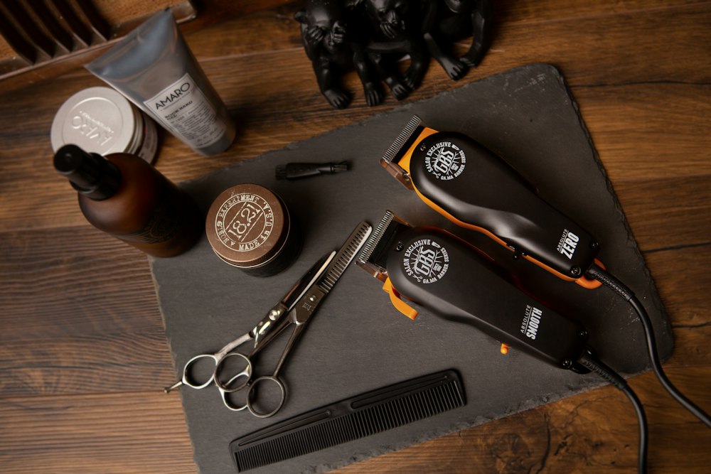 Barber shaping a close fade with comb and clippers