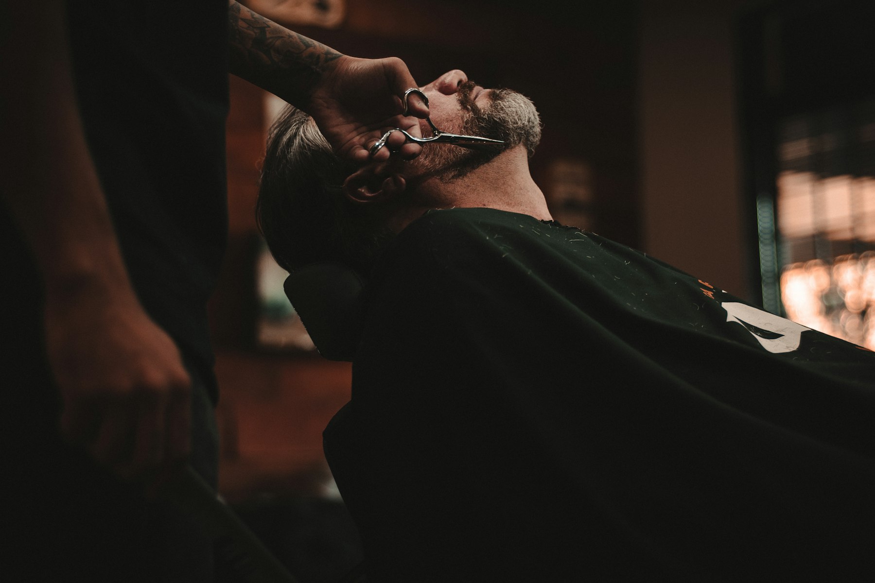 Warm, refined modern barbershop interior with classic barber chairs